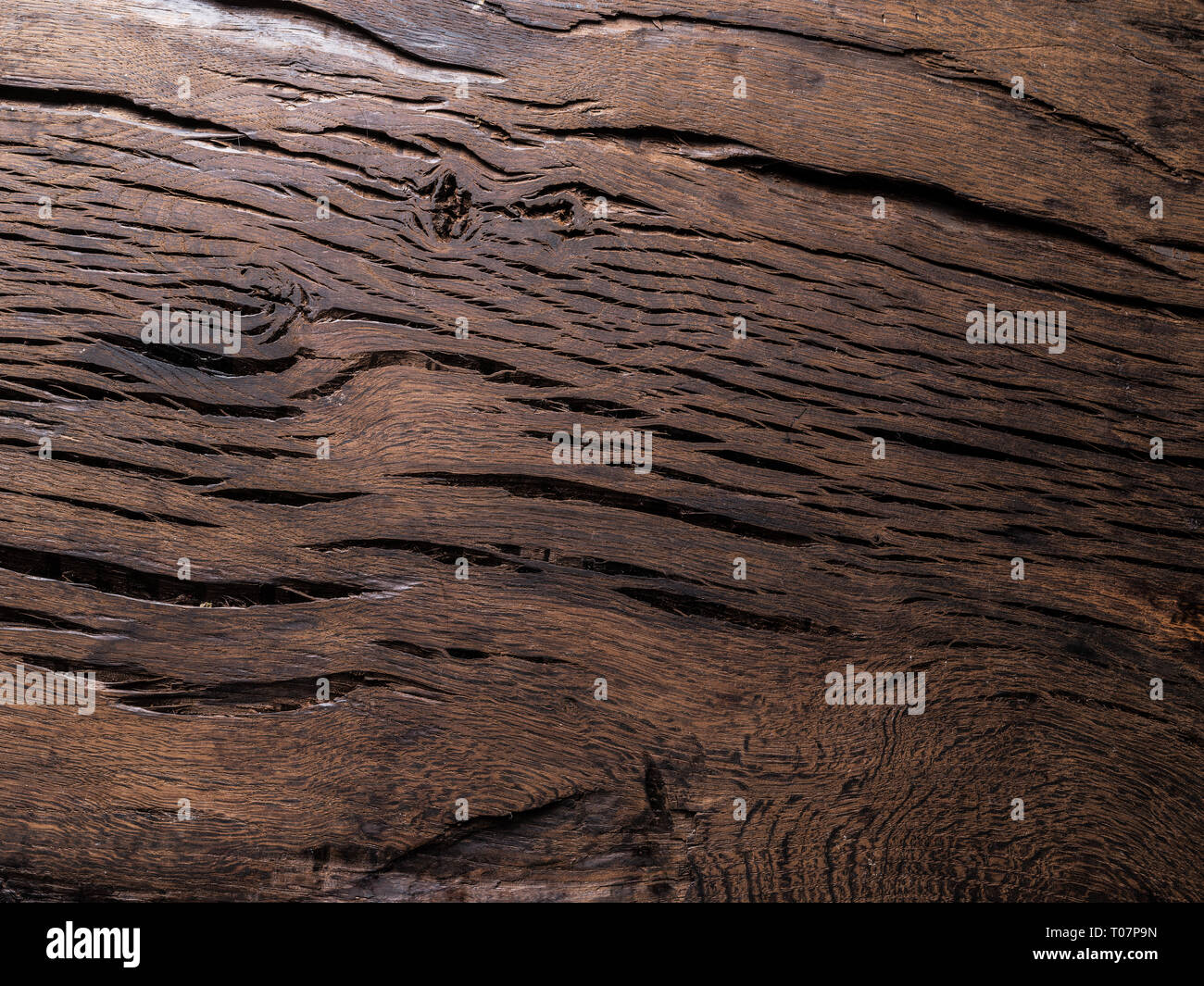 Vieux Fond en bois brun avec noeuds et fissures.Close-up. Banque D'Images