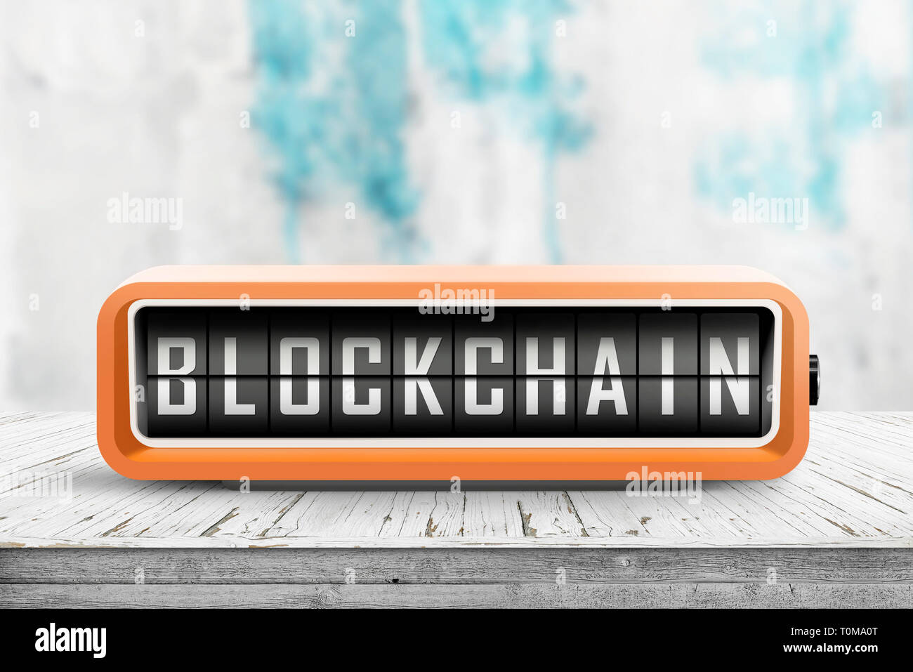 Blockchain sur un message d'alarme réveil rétro sur une table dans une salle lumineuse Banque D'Images