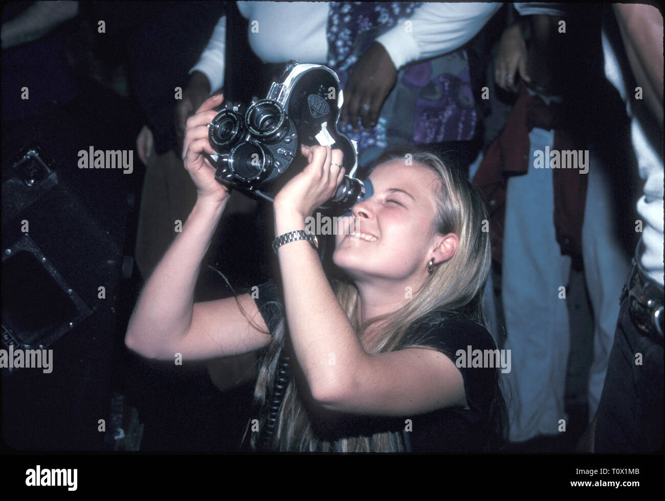 Cette photographe est montré prend un aspect concert 'live' au pied de la scène à New York. Banque D'Images