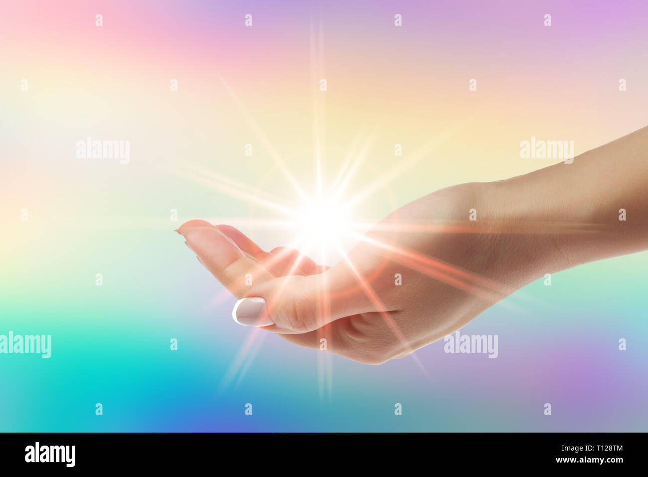 Healing Hands avec sunburst brillant sur fond arc-en-ciel Banque D'Images
