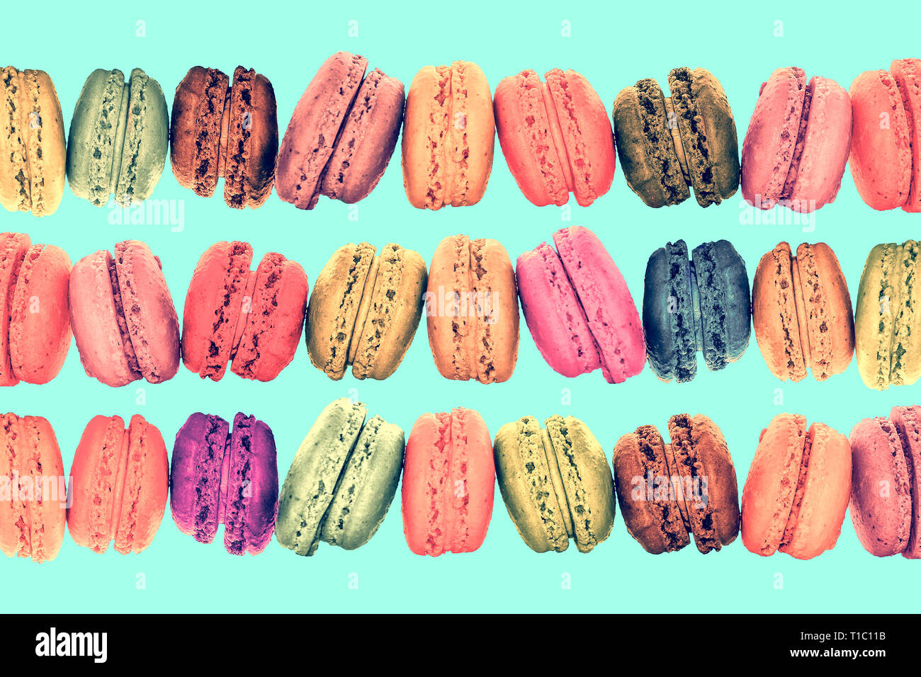 Les lignes colorées sur ses macarons menthe vintage pastel arrière-plan Banque D'Images