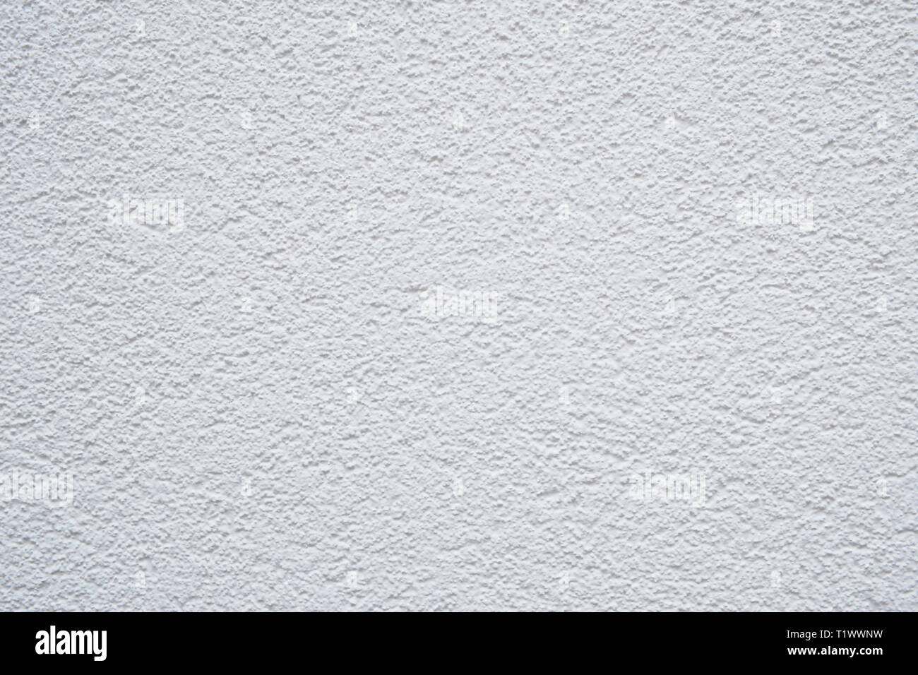 Photo couleur d'un mur blanc avec structure brute comme arrière-plan photo Banque D'Images