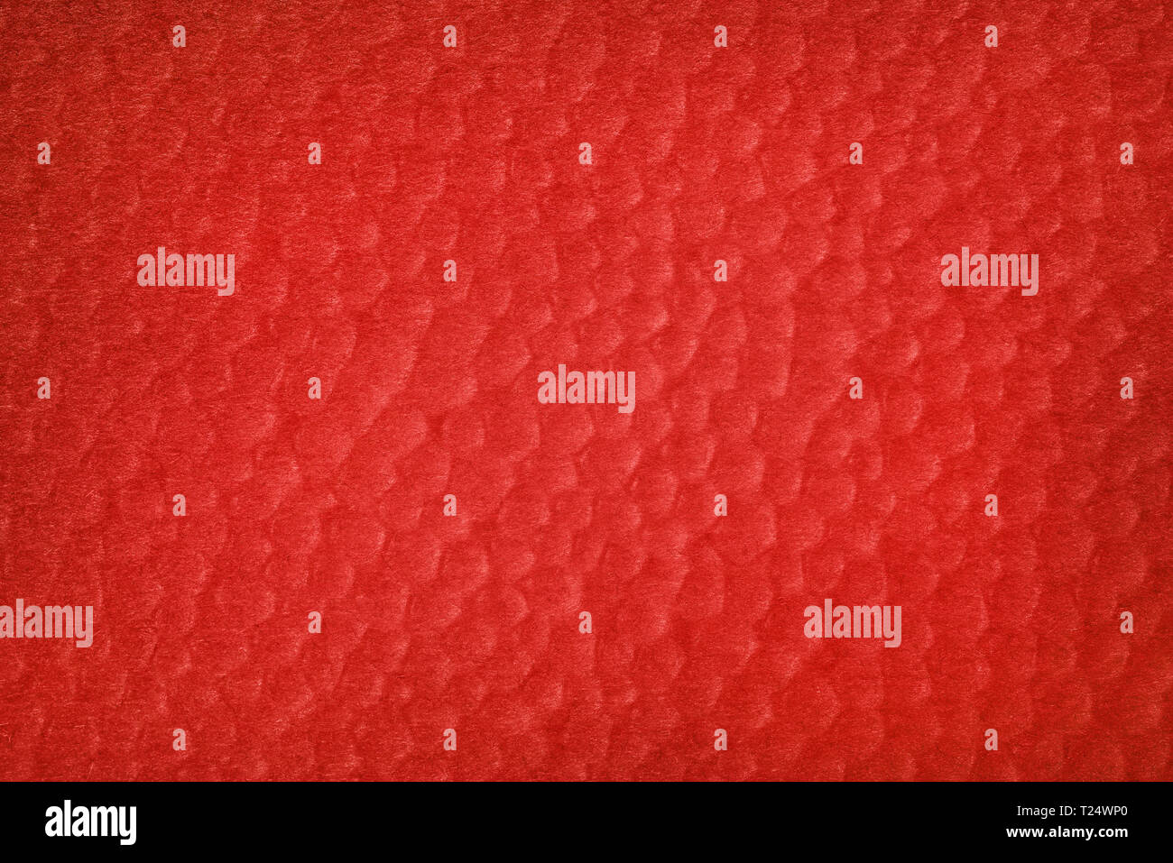 Résumé fond rouge texturé. Bulles sur papier de couleur brique Banque D'Images