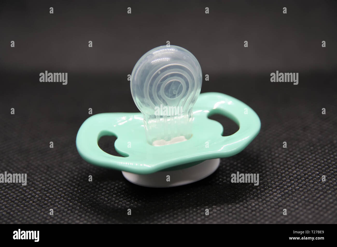 Sucette De Bebe Garcon La Couleur Bleu Fait De Silicone Sucette Sucette Silicone Sur Un Fond Noir Photo Stock Alamy