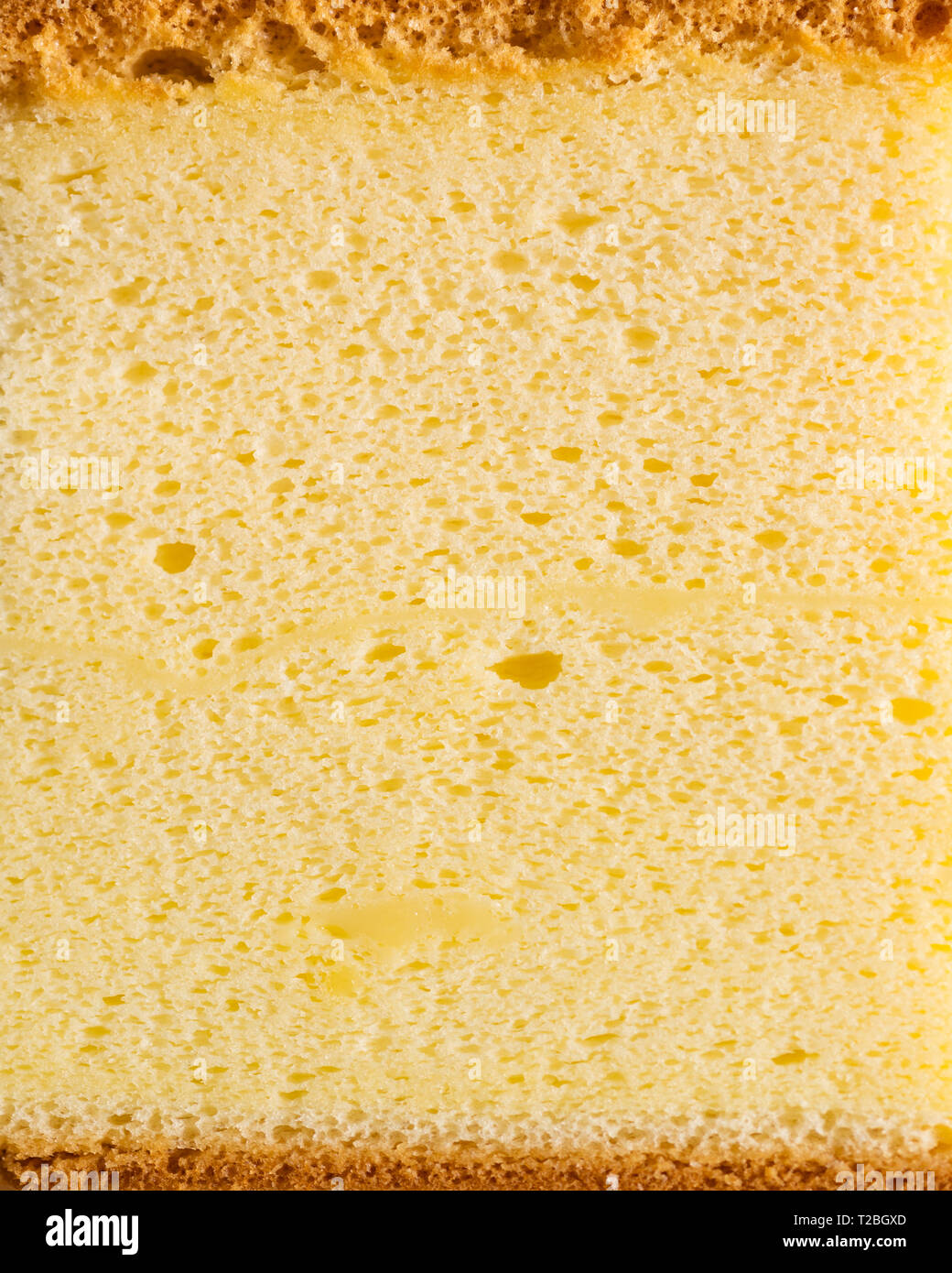 Gâteau éponge verticale macro shot avec texture background Banque D'Images