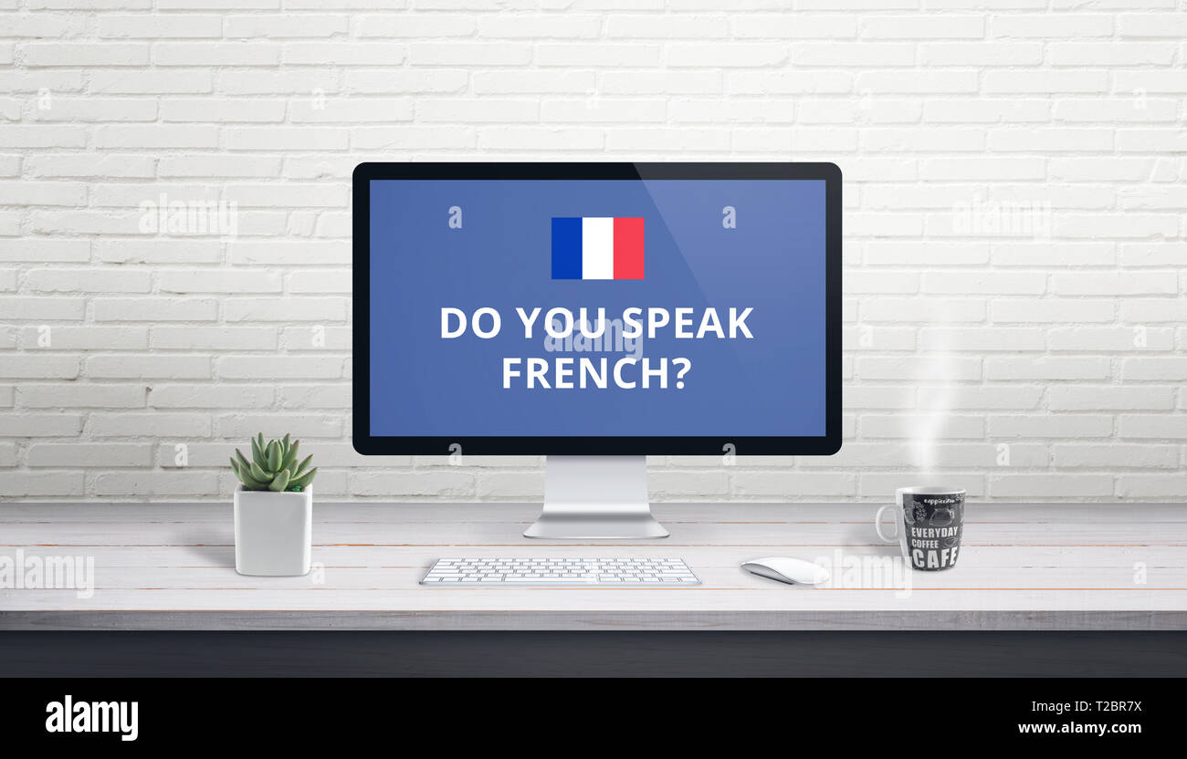 Concept de l'apprentissage de la langue française en ligne. Question Est-ce que vous parlez français avec drapeau français sur l'écran d'un ordinateur de bureau. Banque D'Images