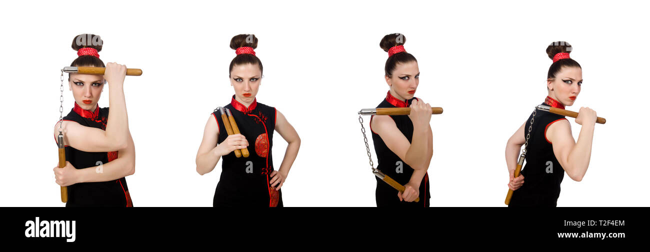 Femme drôle avec nunchucks isolated on white Banque D'Images