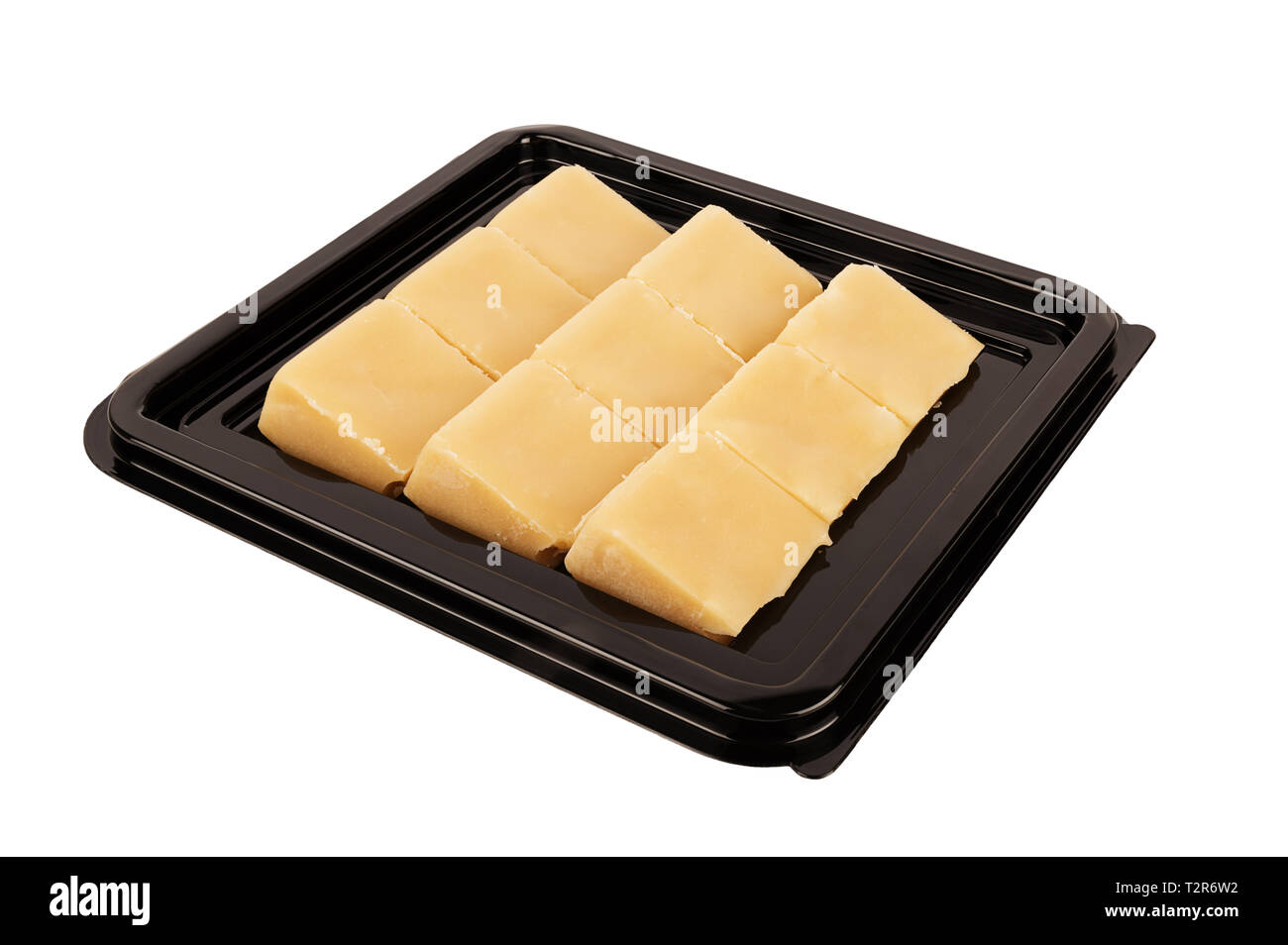 Zoom sur la crème sucre commercial square, isolé sur fond blanc. Les aliments traditionnels. Banque D'Images