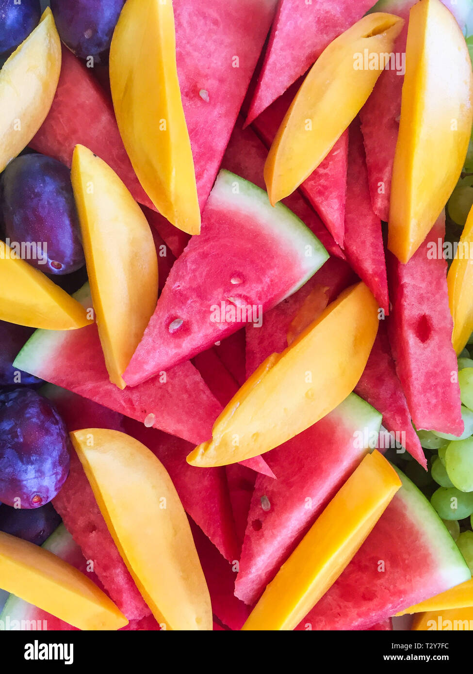 Pastèque, mangue et tranches de fruits prune closeup Banque D'Images