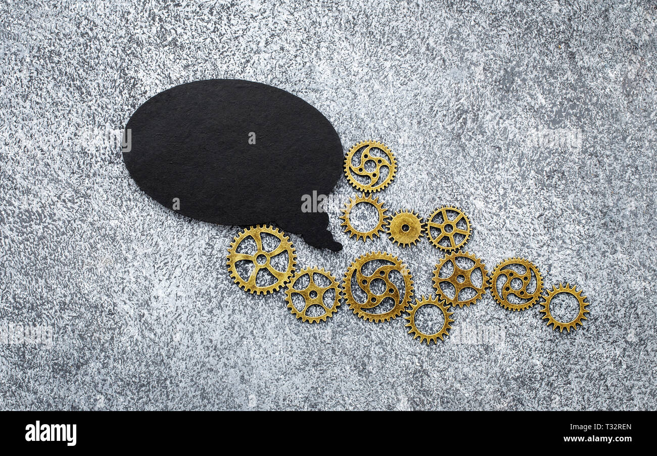 Bulle noire et d'engrenages sur fond noir en gris Banque D'Images