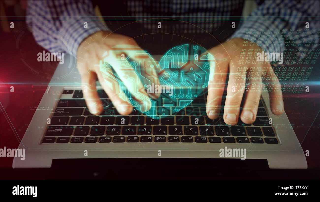 L'homme de la saisie sur clavier d'ordinateur portable avec coeur sur l'écran holographique. Cyber dating, l'amour, romantique, rendez-vous, santé et soins médicaux en ligne concept. Futuri Banque D'Images