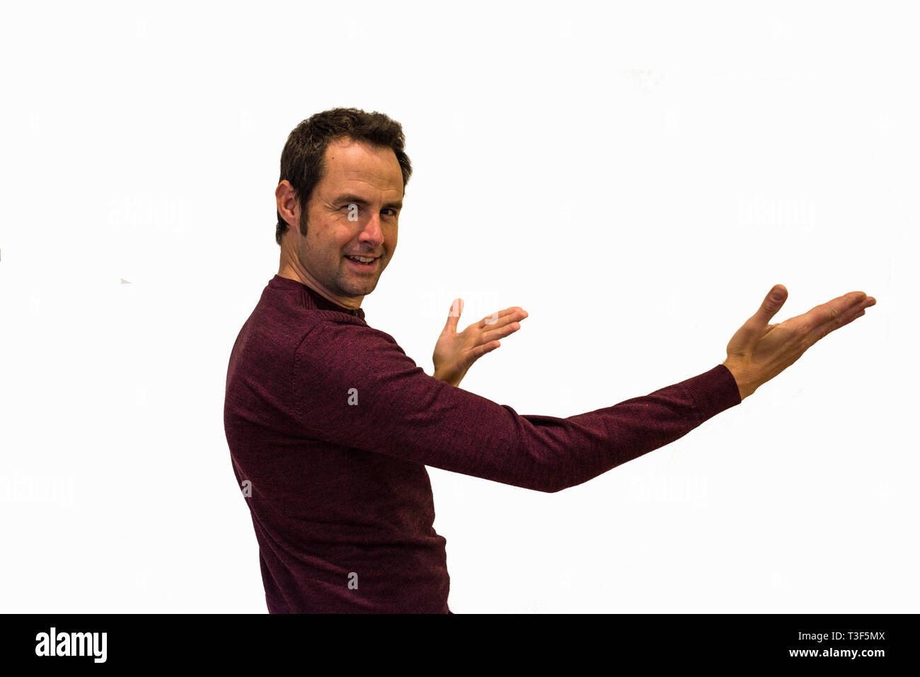 Un beau portrait homme pointant sur fond blanc Banque D'Images