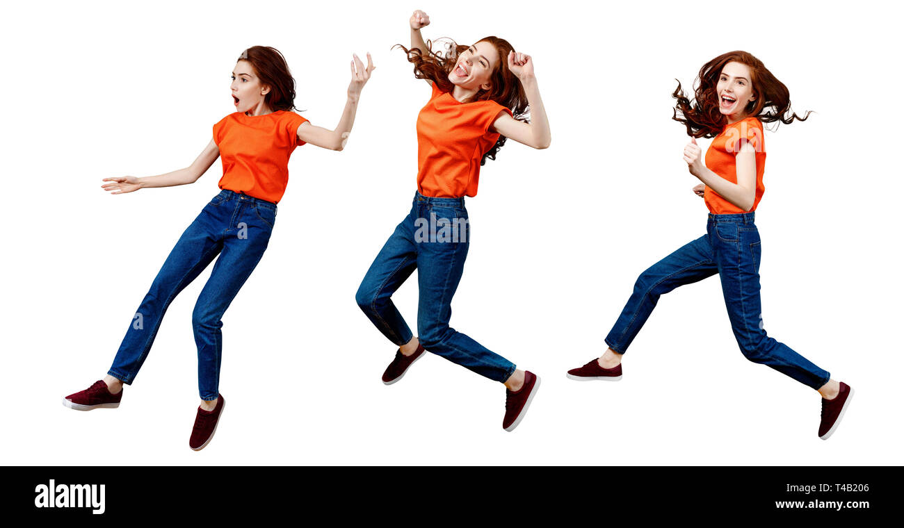 Collage de gingembre heureuse femme en jeans et chemise de saut. Banque D'Images