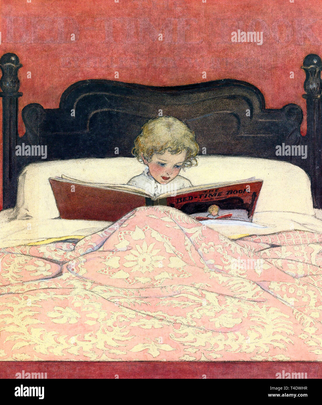 La lecture de l'enfant dans le lit de Jessie Wilcox Smith Banque D'Images