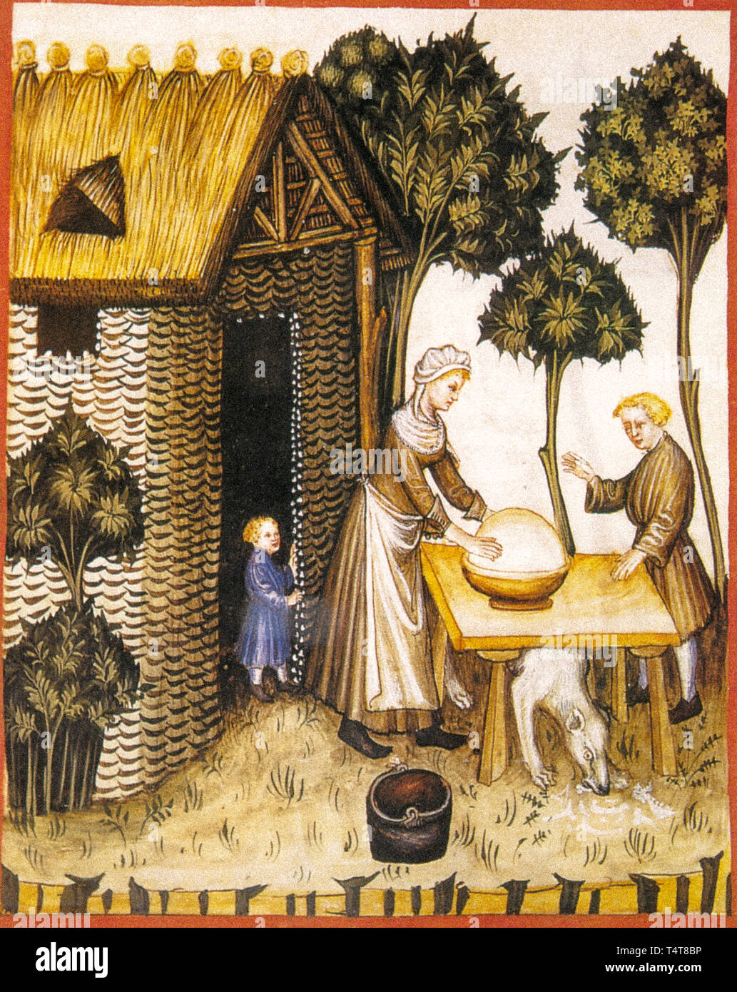 Préparation du beurre dans le Moyen Âge d'une miniature Banque D'Images