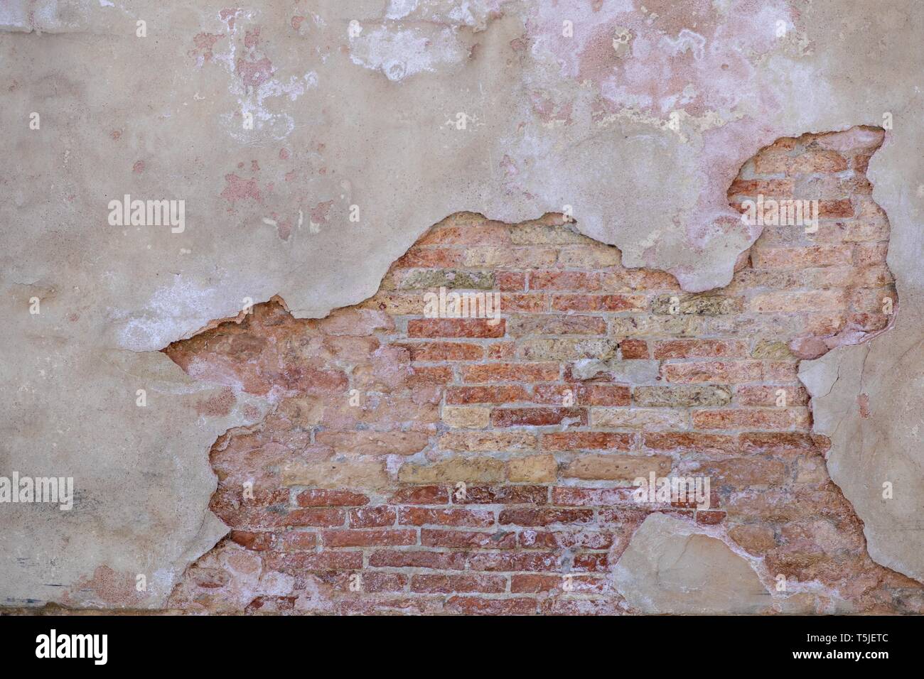 Mur de briques et de stuc texturé Banque D'Images