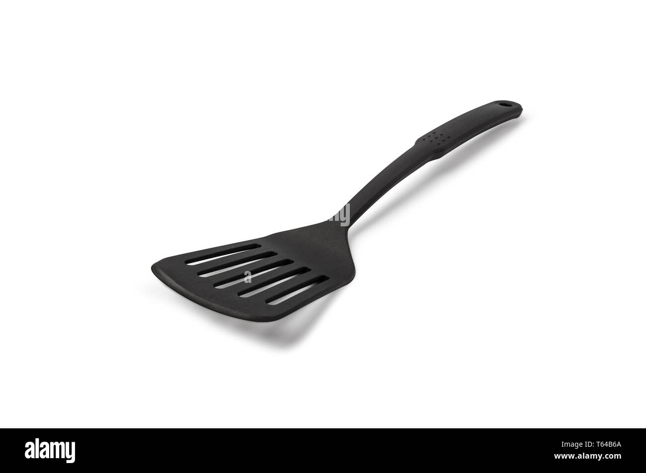 Spatule de cuisine en plastique isolé sur un fond blanc. With clipping path. Banque D'Images