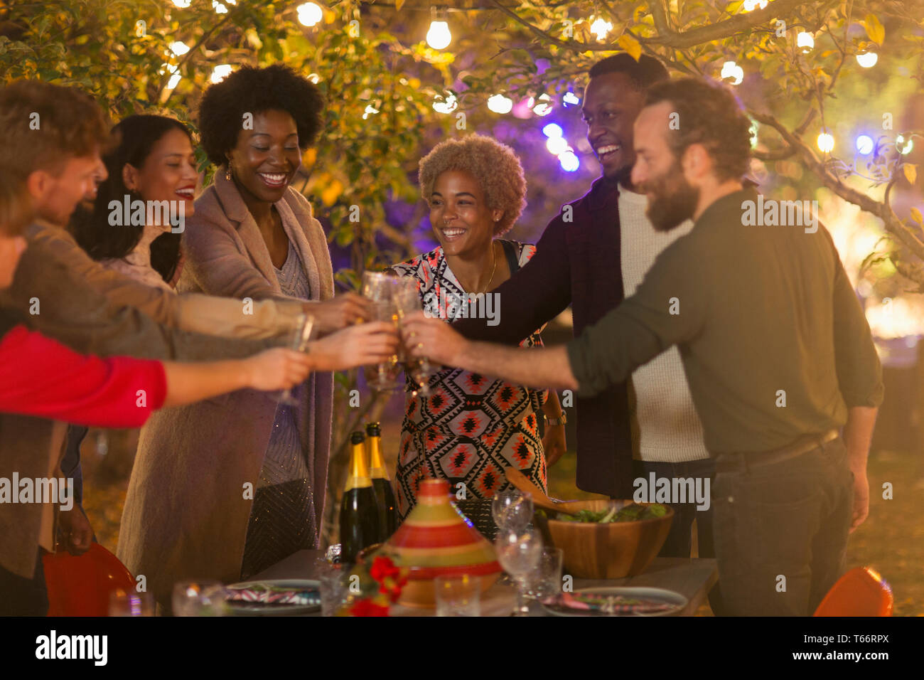 Happy friends with dinner garden party Banque D'Images