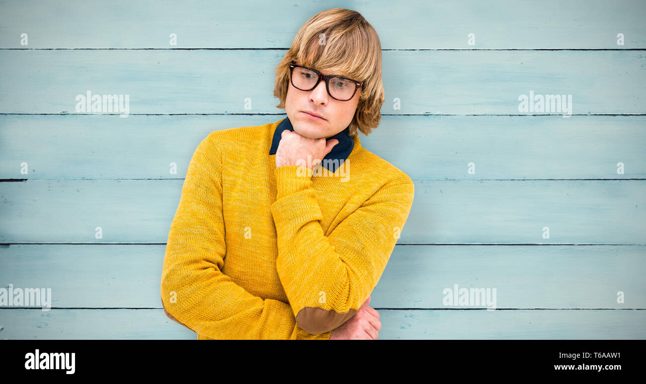 Composite image of thoughtful hipster businessman with hand on chin Banque D'Images