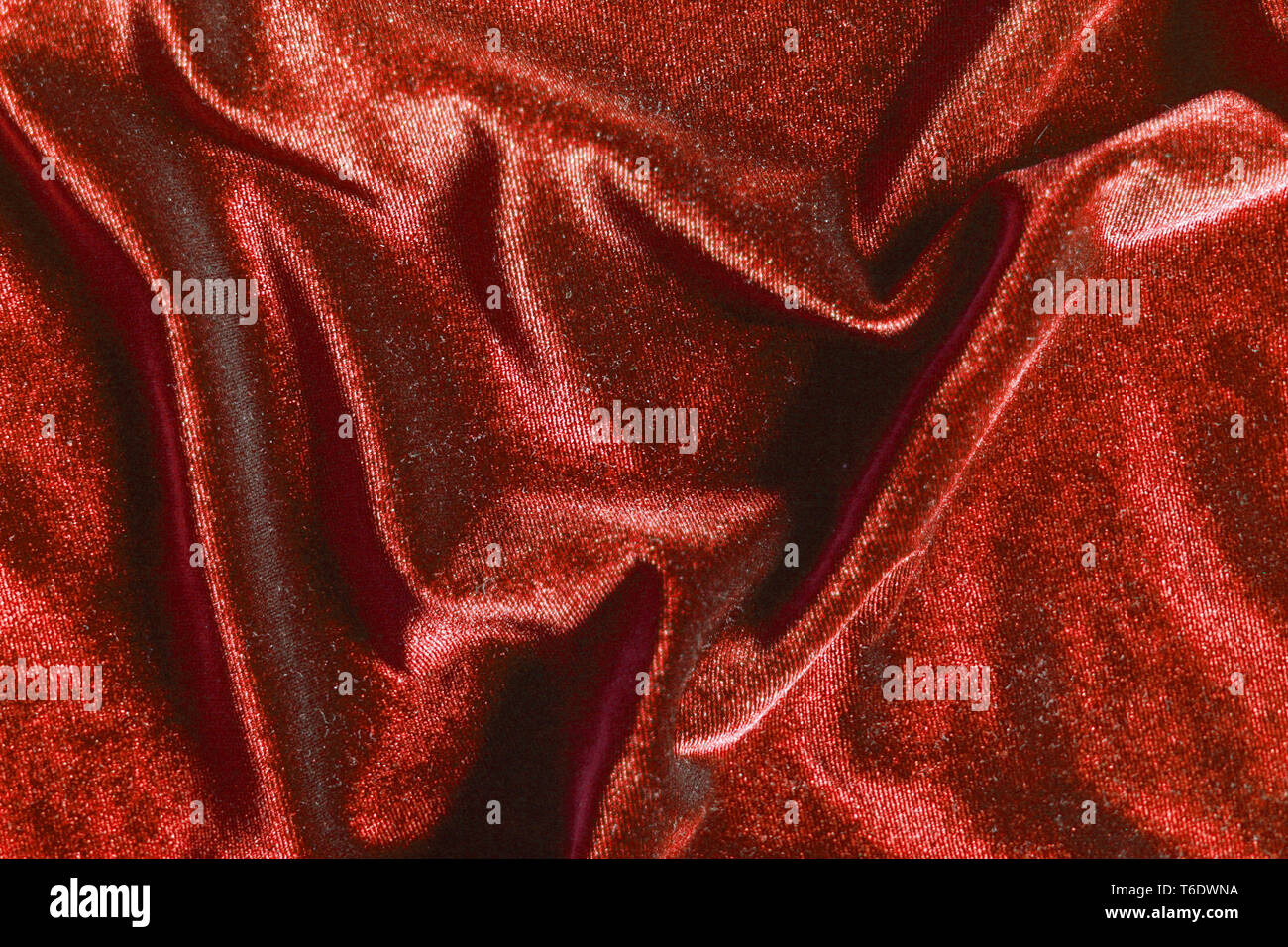 Plis velours fantaisie rouge brillant texture background for design Banque D'Images
