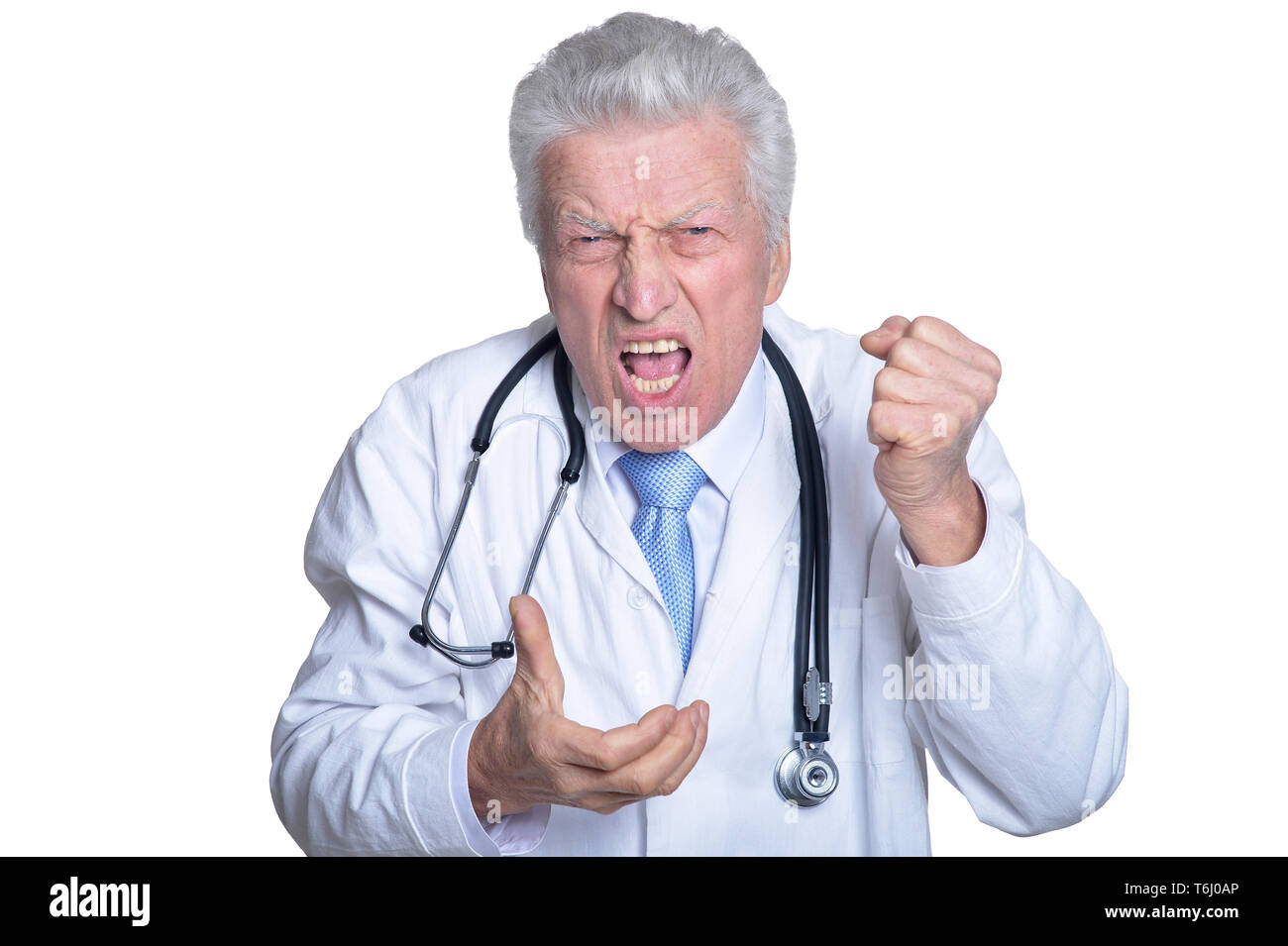 Portrait de angry senior male doctor with stethoscope isolated Banque D'Images