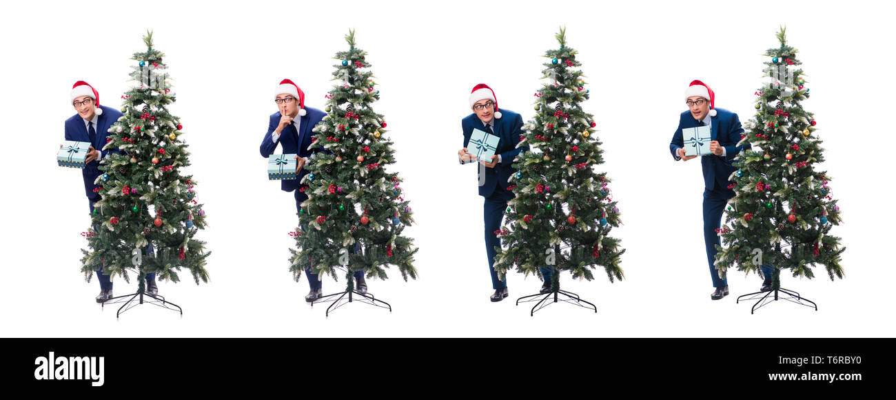 Woman decorating Christmas Tree isolated on white Banque D'Images