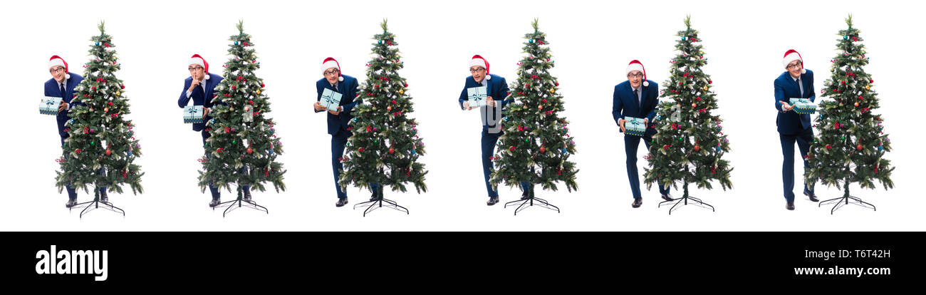 Woman decorating Christmas Tree isolated on white Banque D'Images