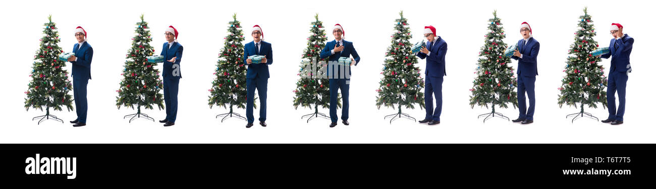 Woman decorating Christmas Tree isolated on white Banque D'Images