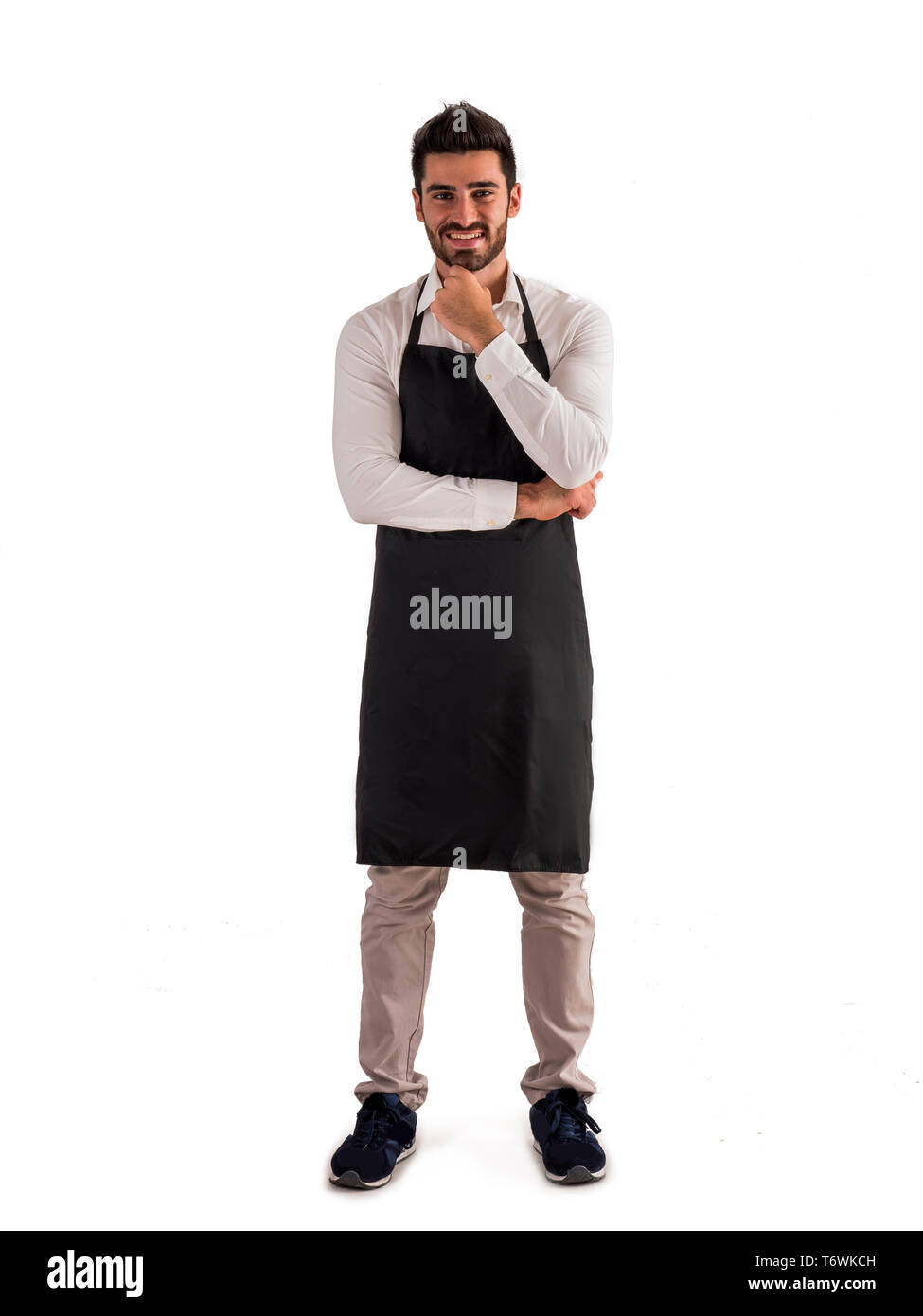 Coup de pleine longueur ou serveur jeune chef posing Banque D'Images