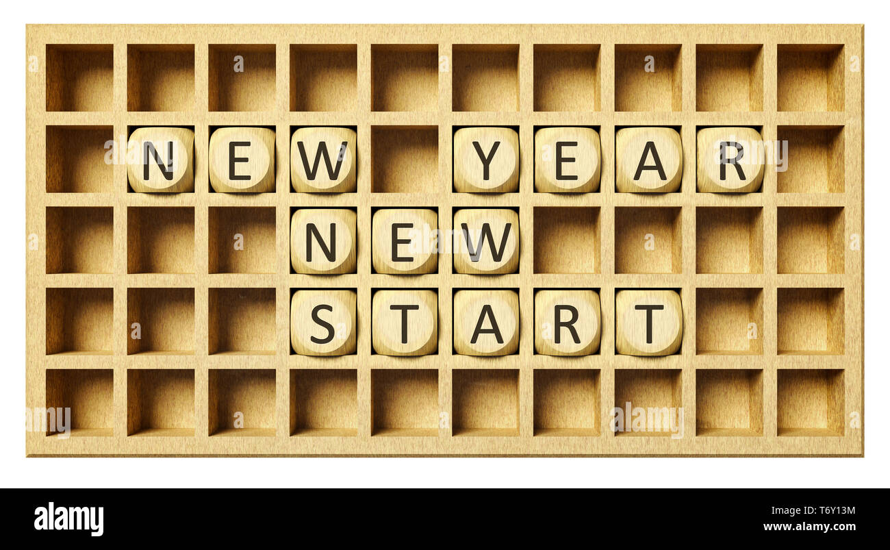 Une grille en bois cubes avec nouvelle année nouveau départ Banque D'Images