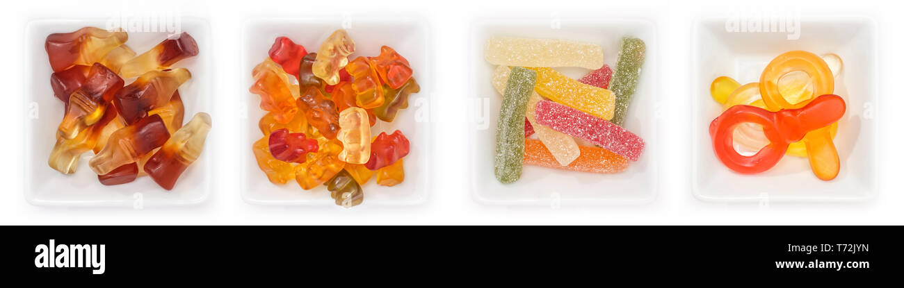 Collection de différents bonbons aux fruits de la gomme dans des bols en vue supérieure Banque D'Images