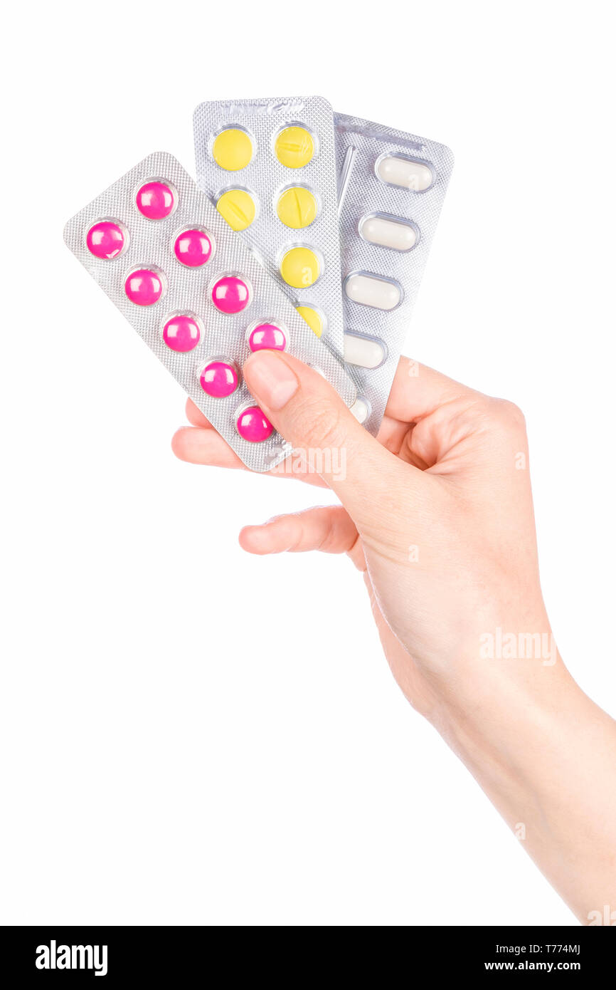 Woman hand holding pills comprimé. Femme hand holding pill prescription sur fond blanc. Banque D'Images