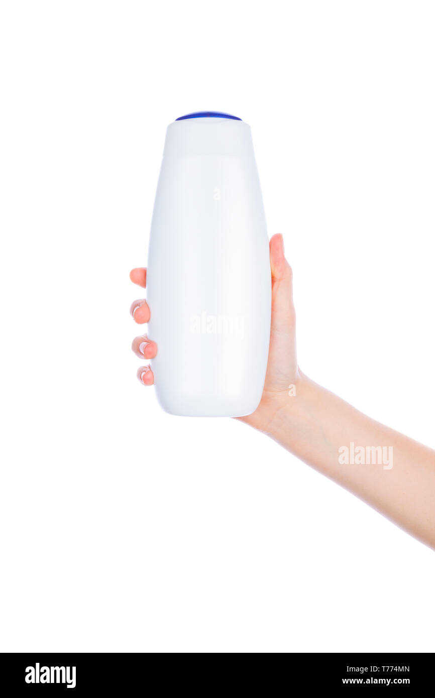 Bouteille de blanc crème lotion gel douche dans les mains sur un fond blanc l'isolement Banque D'Images