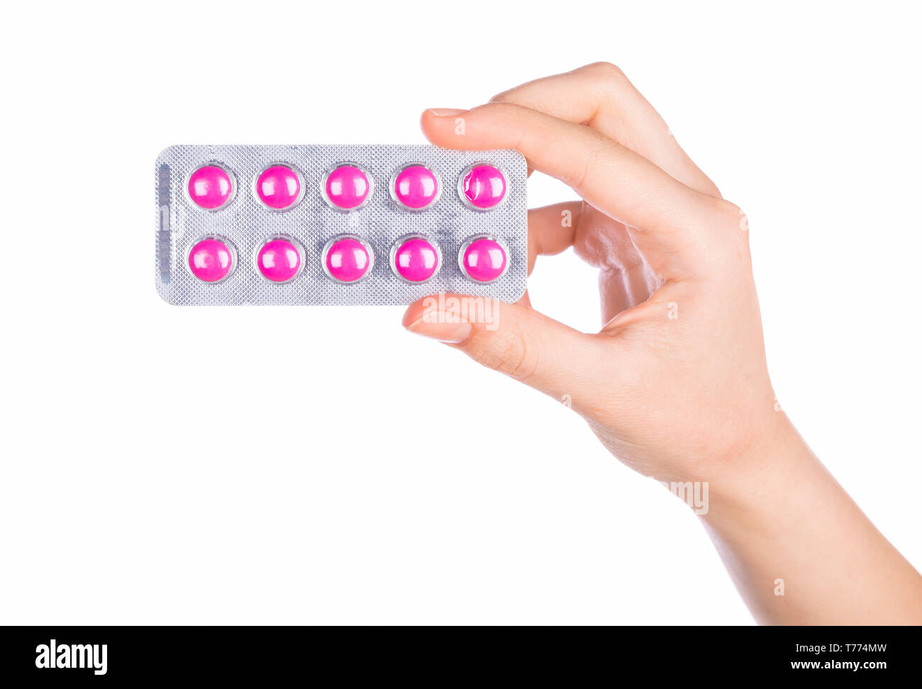 Woman hand holding pills comprimé. Femme hand holding pill prescription sur fond blanc. Banque D'Images