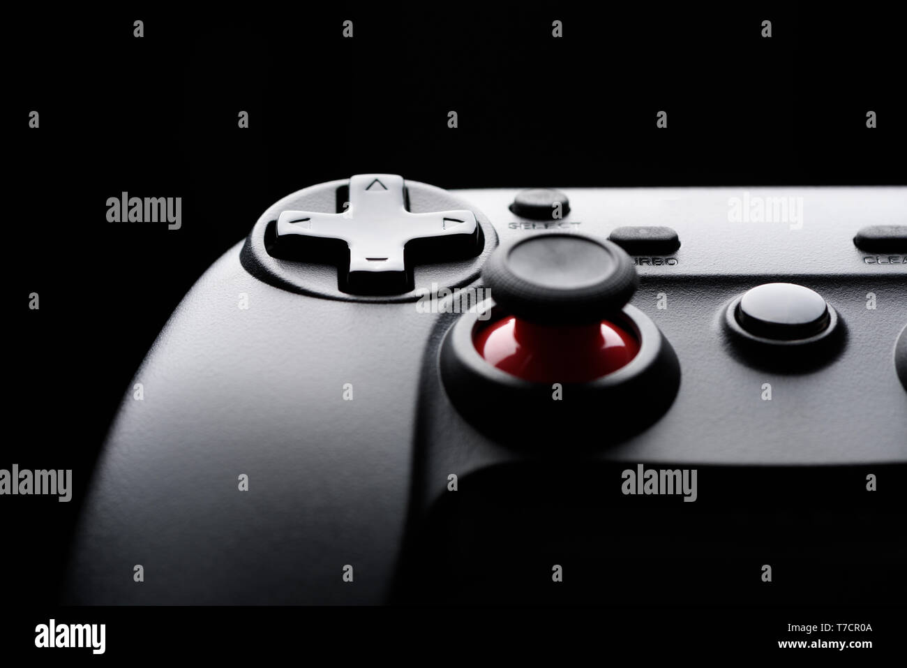 Manette de jeu vidéo contrôleur silhouette sombre jeu macro close-up Banque D'Images