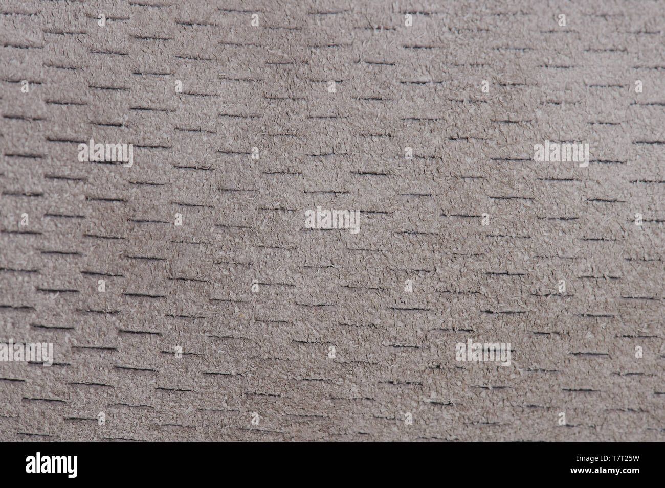 Tissu duveteux gris perforé texture background vue plate Banque D'Images
