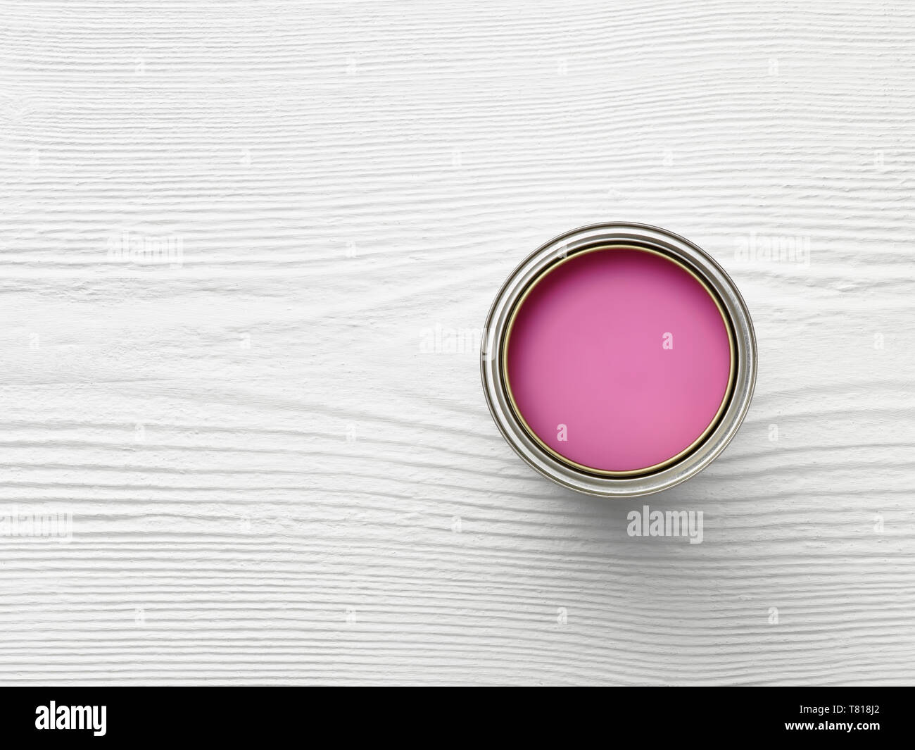 photo de dessus de la tête d'un pot de peinture sur la surface de bois blanc avec peinture rose Banque D'Images