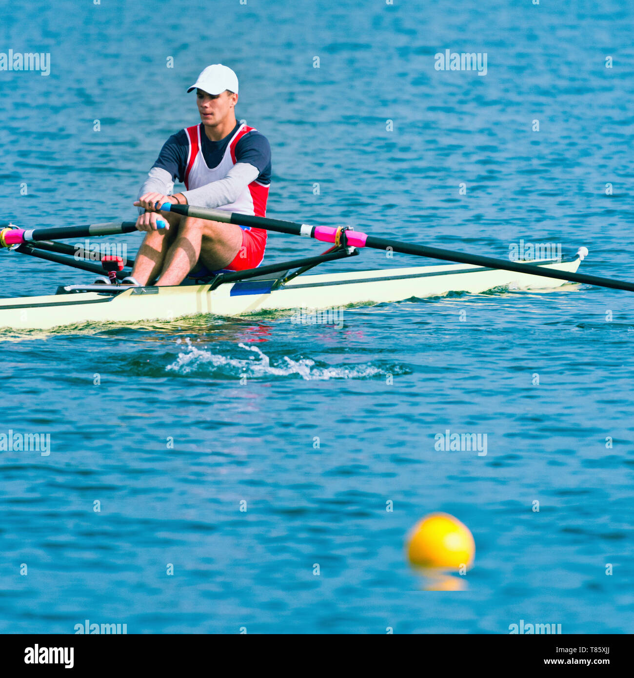 Man rowing scull Banque D'Images