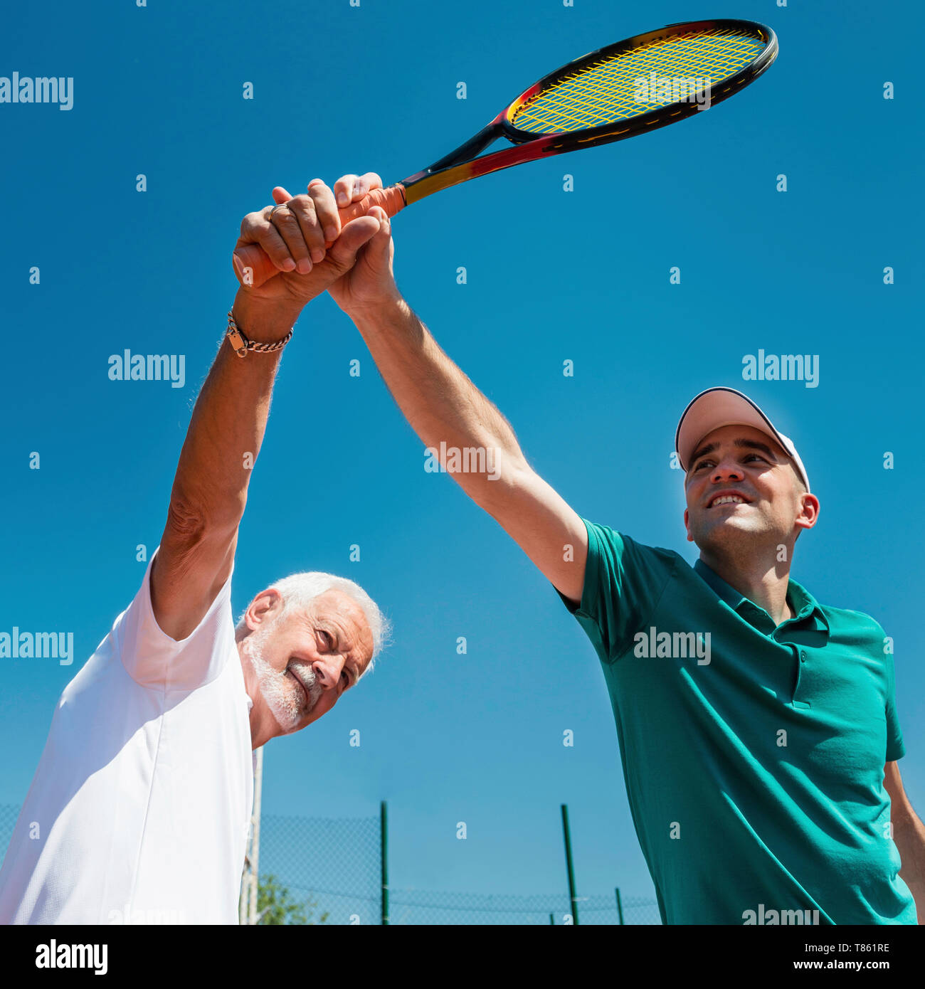 Man avec instructeur de tennis Banque D'Images