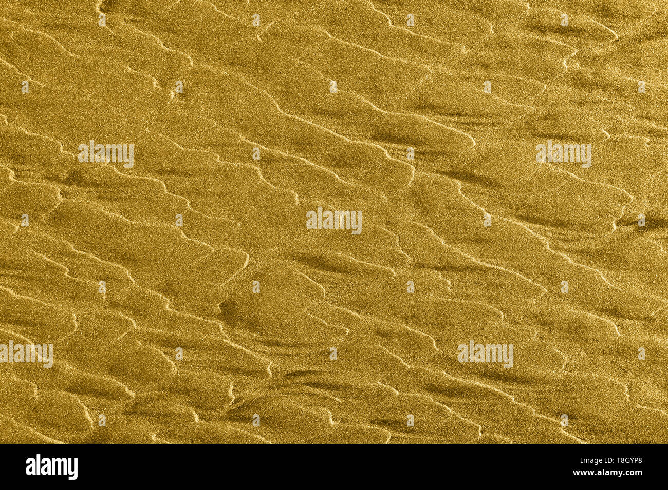 Vagues de sable doré abstract background texture avec copyspace. Banque D'Images