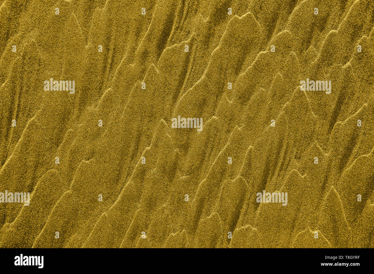 Vagues de sable doré abstract background texture avec copyspace. Banque D'Images