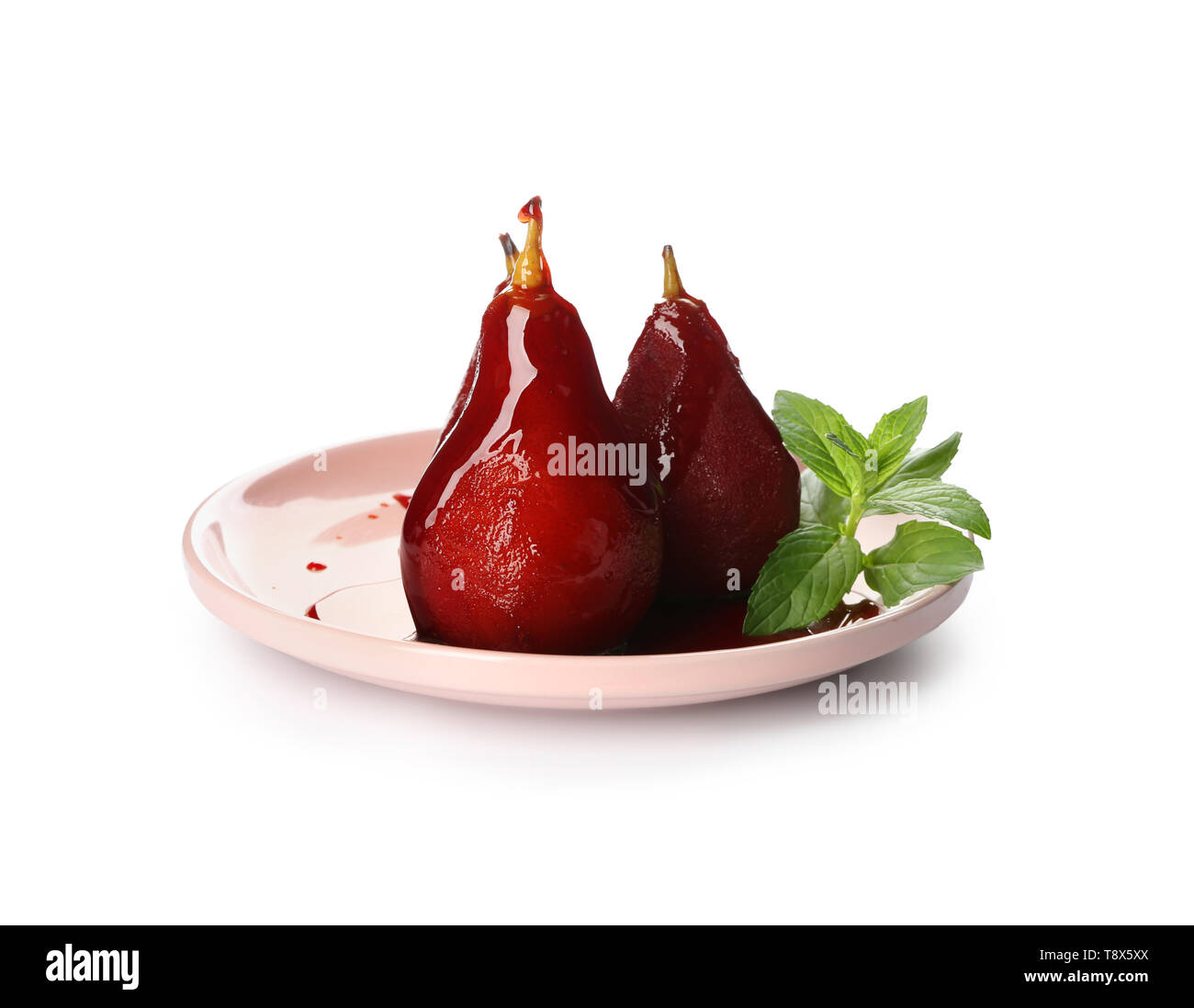 Plaque avec de délicieux confit de poires au vin rouge sur fond blanc Banque D'Images