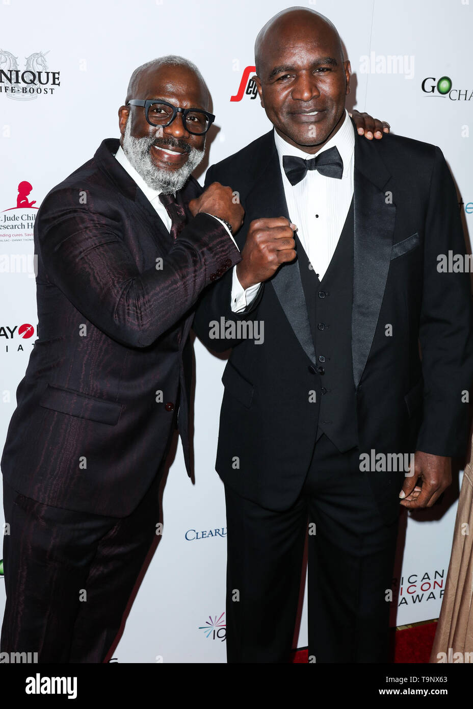 BEVERLY HILLS, LOS ANGELES, CA, USA - Le 19 mai : BeBe Winans Evander Holyfield et arriver à l'icône américaine Awards 2019 qui a eu lieu au Beverly Wilshire Four Seasons Hotel le 19 mai 2019 à Beverly Hills, Los Angeles, Californie, États-Unis. (Photo par Xavier Collin/Image Press Office) Banque D'Images