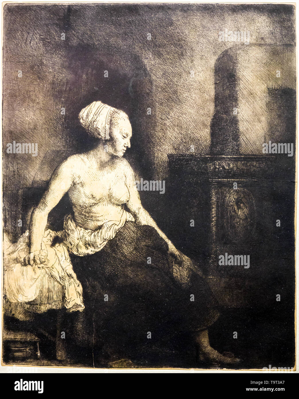 Rembrandt van Rijn (1606 -1669) Femme assise robe demi-par une cuisinière , 1658 Eau-forte, pointe sèche et la gravure avec ton surface sur papier Japon Banque D'Images