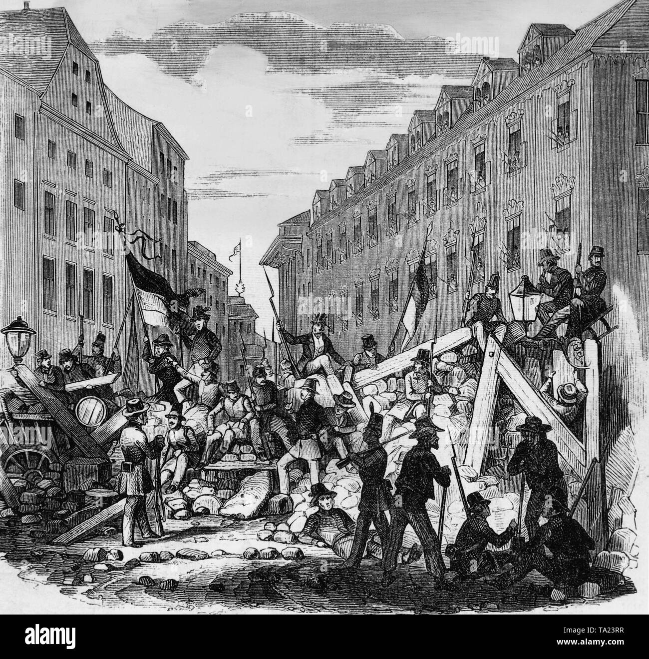 L'insurrection révolutionnaire a été soutenue principalement par la classe ouvrière et les étudiants. Ils lutte derrière les barricades au Palais de l'archevêque sur Stephen's Square à Vienne. Les révolutionnaires s'acquitter noir-rouge-or bannières. Banque D'Images
