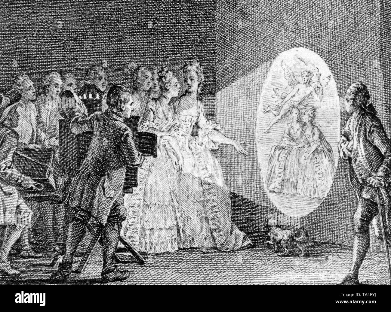 Déjà dans la période Rococo, les gens étaient amusés par les images produites par la lanterne magique. Au début, les images étaient en noir et blanc, dans le 19e siècle, ils ont utilisé des panneaux de verre de couleur vive et de l'ampoule électrique a remplacé le pétrole et bougie mèche. Banque D'Images
