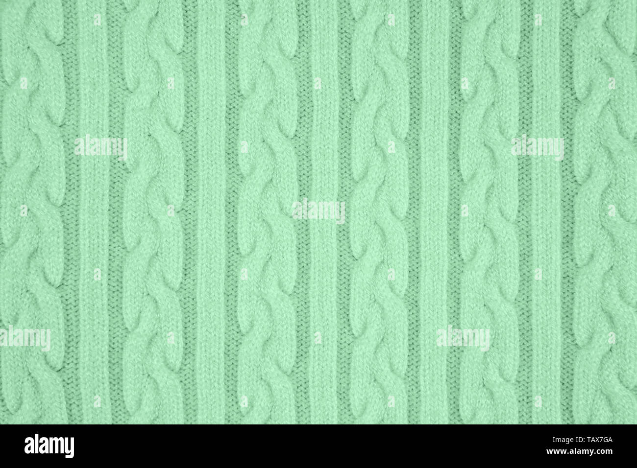 Couleur menthe à la texture de tissu tricot avec des nattes et de rayures. Tricot Machine répéter la texture de chandail. En arrière-plan. Couleur de la Banque D'Images
