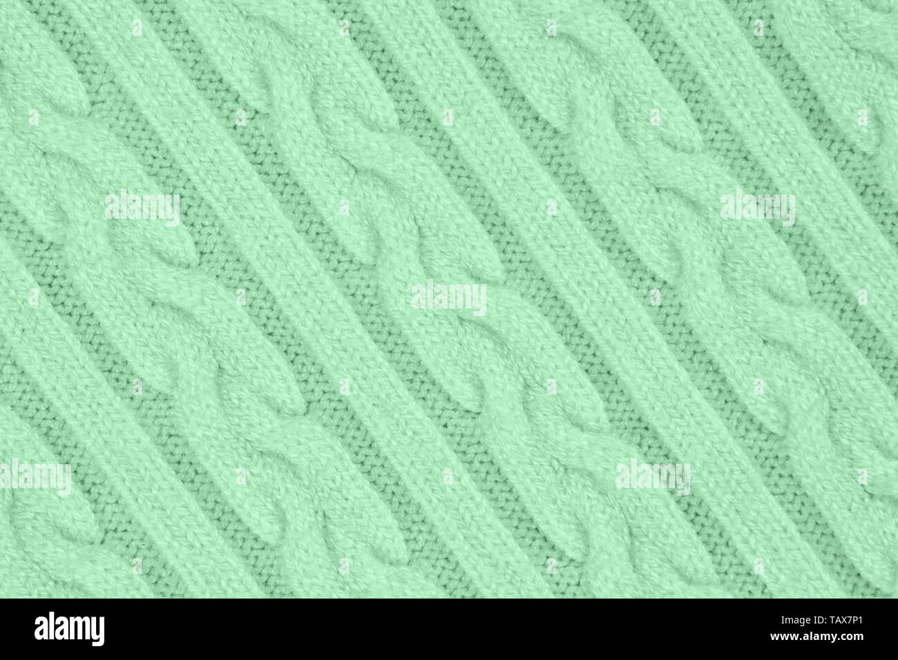 Couleur menthe à la texture de tissu tricot avec des nattes et de rayures. Tricot Machine répéter la texture de chandail. En arrière-plan. Couleur de la Banque D'Images