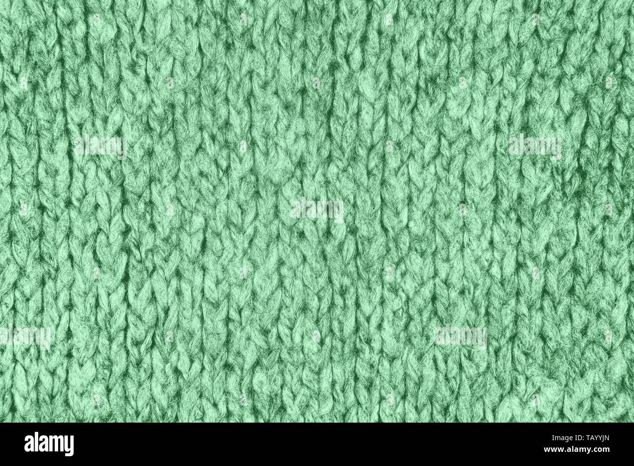 Tissu maille lâche avec la texture de laine. Tricot Machine à répétition de Texture chandail chaud. Fond tricoté gris. Banque D'Images