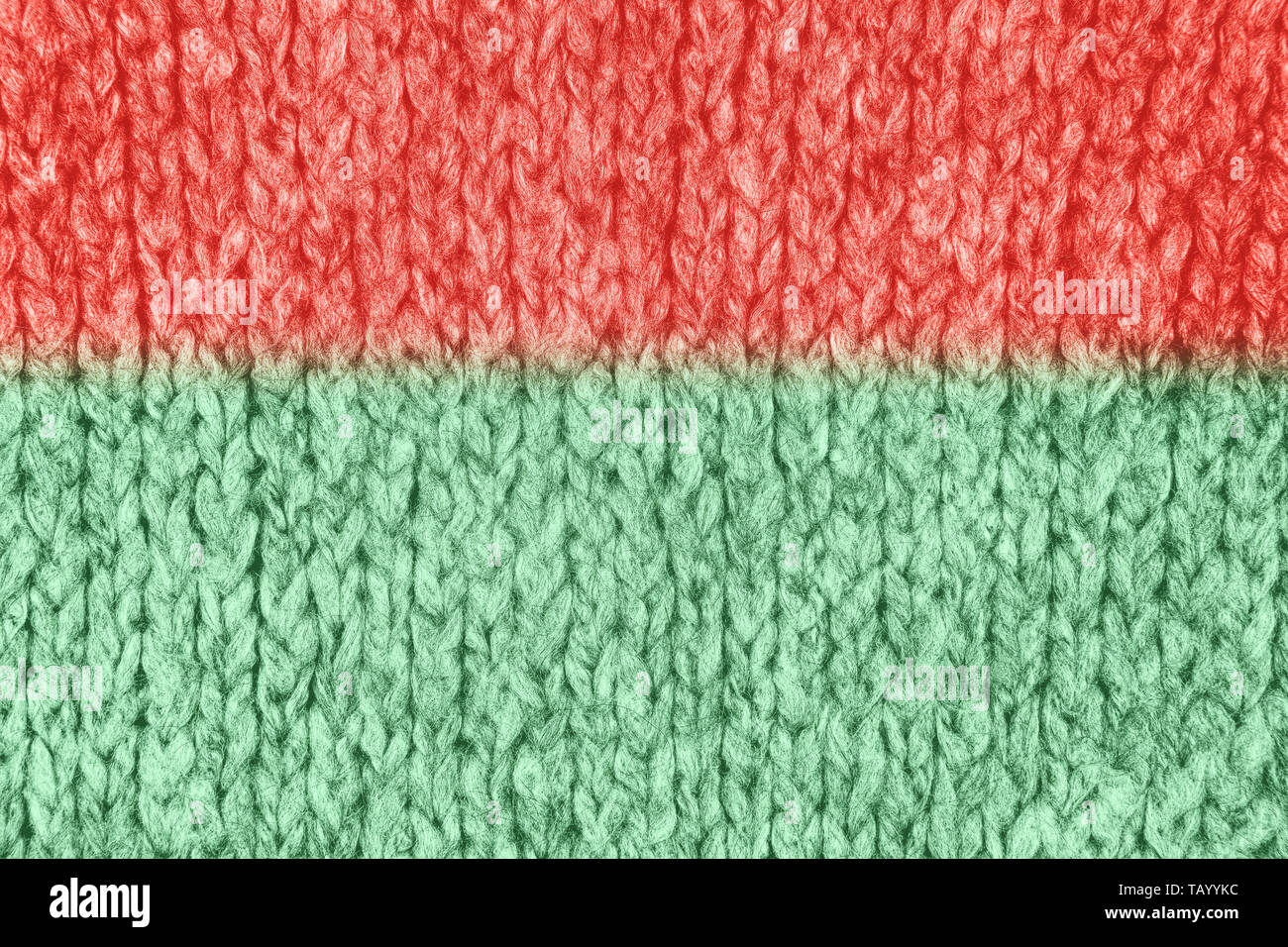 Tissu maille lâche avec la texture de laine. Tricot Machine à répétition de Texture chandail chaud. Fond tricoté gris. Banque D'Images